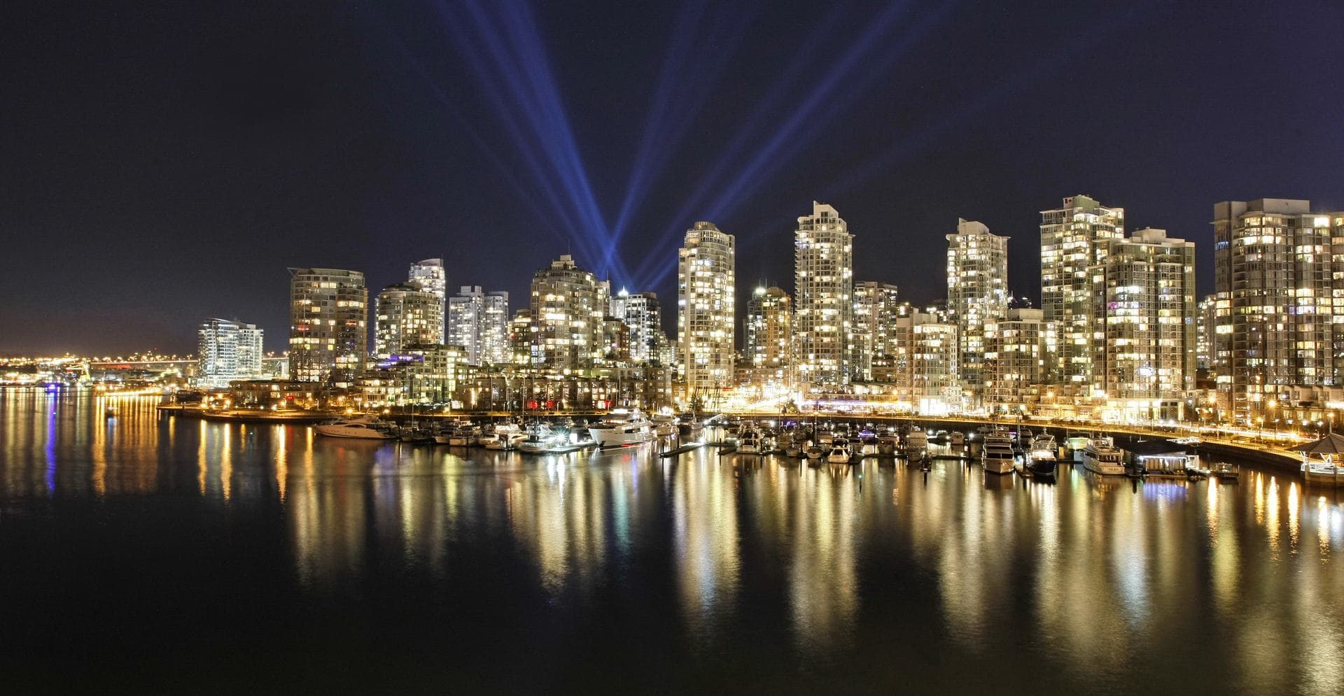 A coastal city skyline from the water.